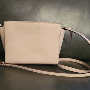 Kate Spade New York Hayden crossbody bag in a light pink leather finish.
